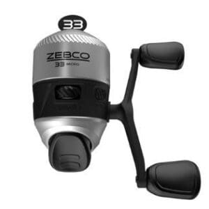 Compact silver and black fishing reel with dual handles.