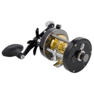 A black and gold fishing reel with a handle.