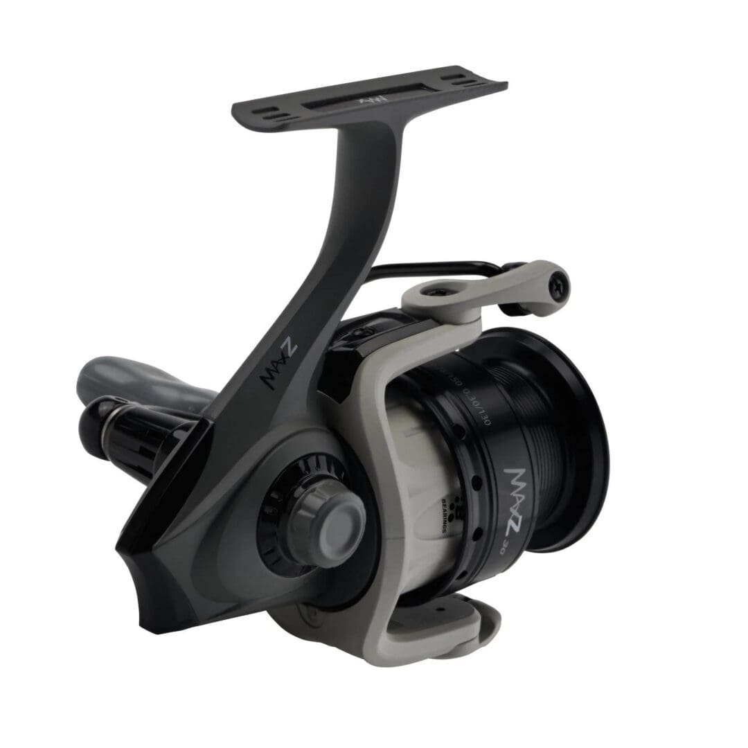 A black and silver fishing reel with a spool and handle.