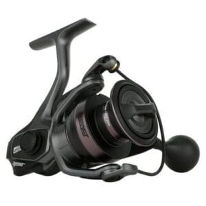 Close-up of a black fishing reel with a large handle.