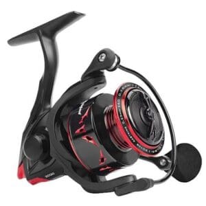 Black and red fishing reel with ergonomic handle.
