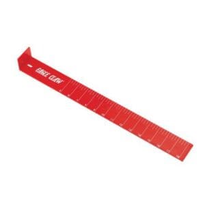 Red plastic tool with markings, likely a measuring device.